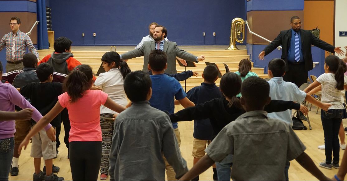 Students learning to breathe in and out with control for 4, 6, 8, and 10 counts.