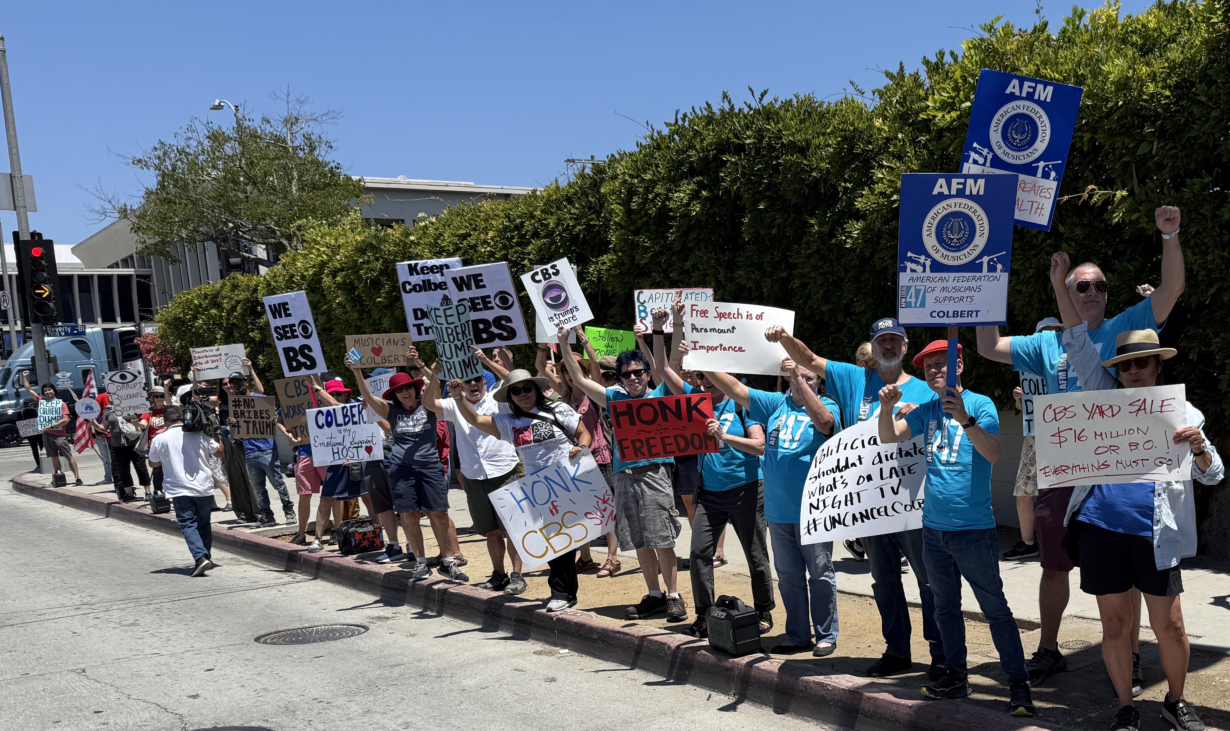 AFM Local 47 Vice President Marc Sazer, Secretary/Treasurer Gail Kruvand, members David Horne, Eric Ekstrand and more spent a sunny Sunday rallying in support of Stephen Colbert following the cancellation of his popular late-night show.
